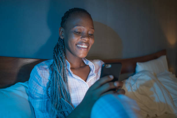 African Healthcare Professional checking finances